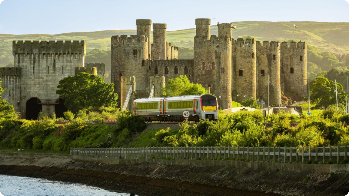 TfW train in front of a castle