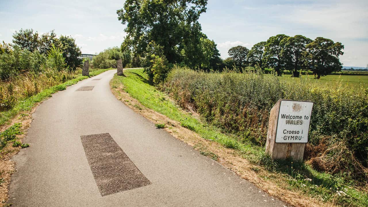 Walking trail with welcome to Wales sign